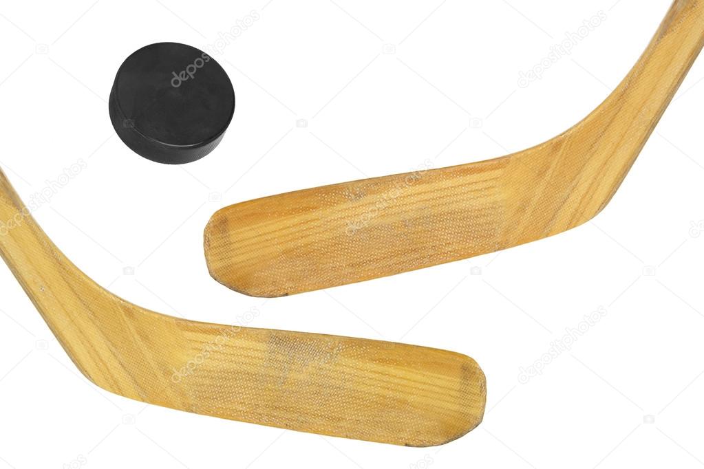 Two hockey sticks and puck
