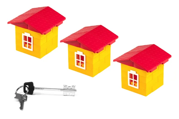 Three houses and keys — Stock Photo, Image