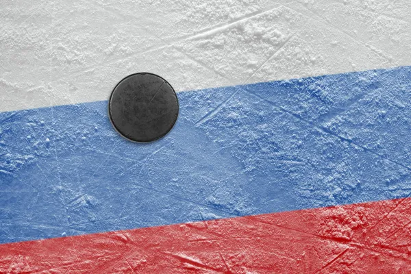 Russian flag and the puck on the ice — Stock Photo, Image