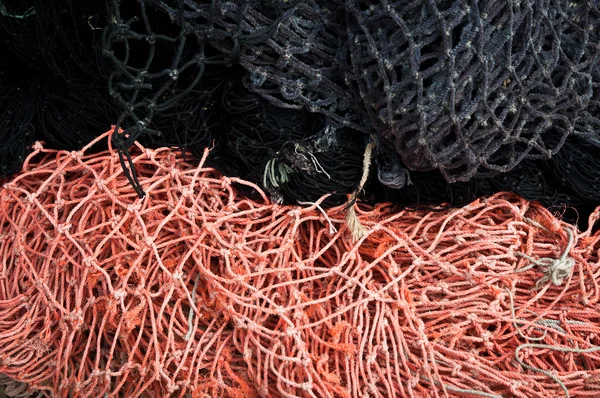Red and black fishing nets — Stock Photo, Image