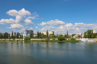 Vinnytsia, Ukraine - August 06, 2022: Greek Catholic Church of Blessed Virgin Mary (left) over the river Southern Bug 