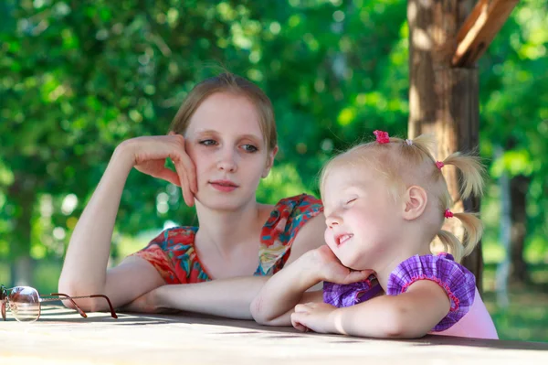 Beautiful young mother and her daughter — Stock Photo, Image