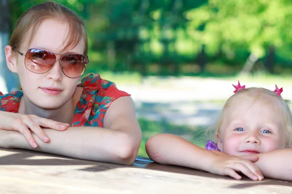 Beautiful young mother and her daughter — Stock Photo, Image