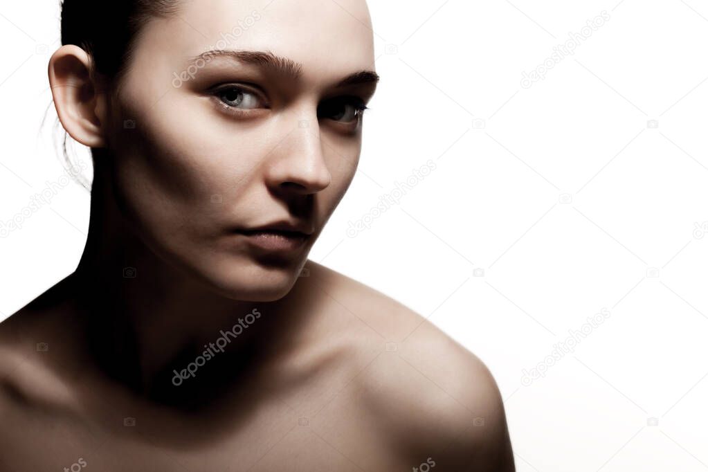 studio portrait of a beautiful young woman against white backgroung.