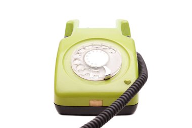Beyaz arka planda yeşil telefon retro tarzı. Klasik telefon ahizesi alıcısı.