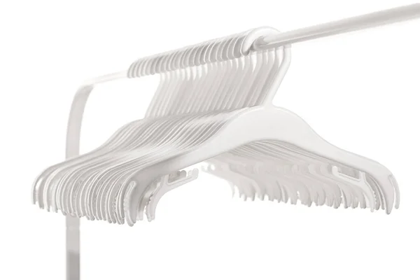 White Plastic Hangers Clothes Hanging Rod Clothing Rack Isolated White — Stock Photo, Image