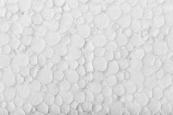 Sıkıştırılmış beyaz köpük arkaplanının özet desen fotoğrafını kapat.
