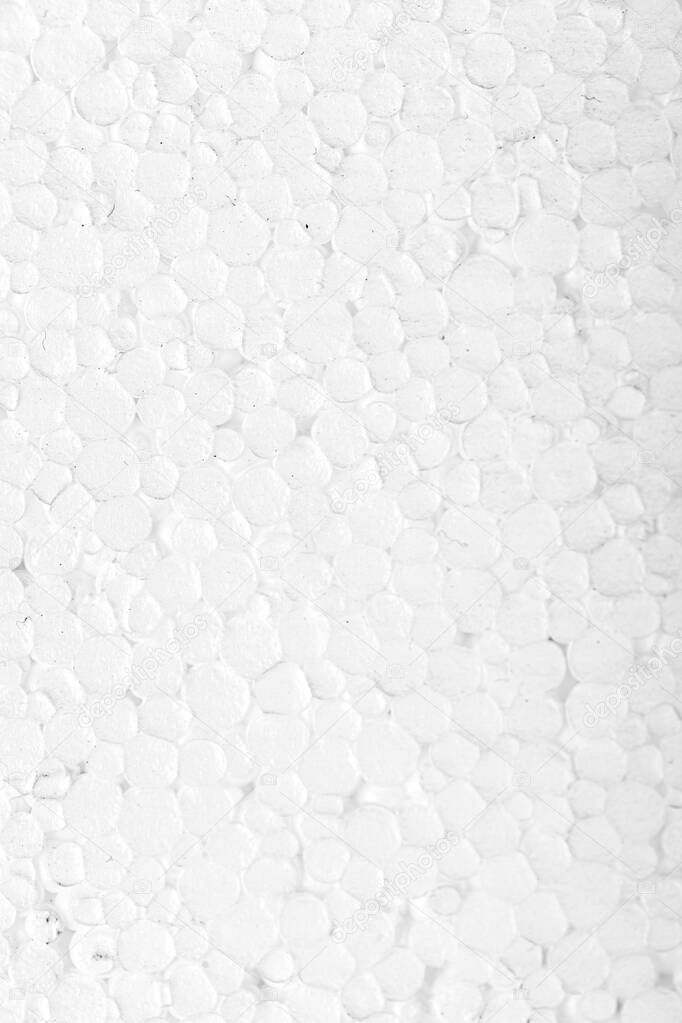Abstract close up texture photo of compressed white styrofoam background.