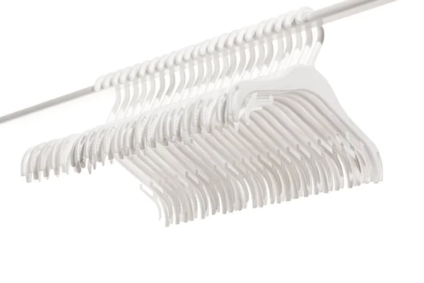 White Plastic Hangers Clothes Hanging Rod Clothing Rack Isolated White — Stock Photo, Image