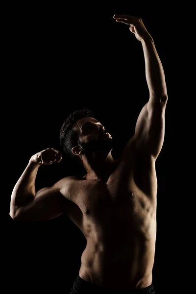 Lato Illuminato Muscolare Uomo Caucasico Silhouette Atleta Posa Contro Sfondo — Foto Stock