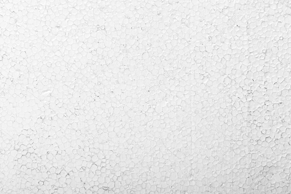 Abstract close up texture photo of compressed white styrofoam background.