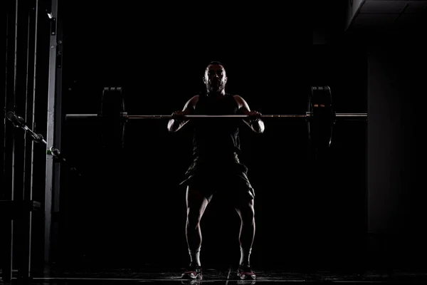 Atleta Levantando Barra Silueta Hombre Musculoso — Foto de Stock