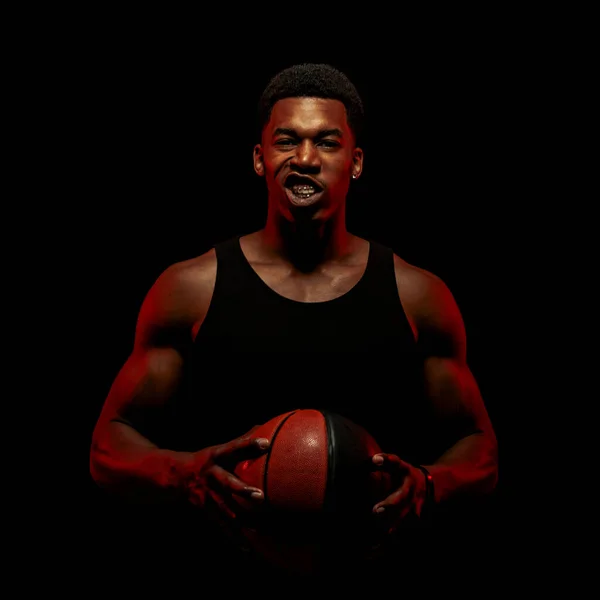 Basketball Player Side Lit Red Color Holding Ball Black Background — Stock Photo, Image