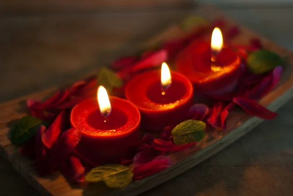 Red candles in spa salon — Stock Photo, Image