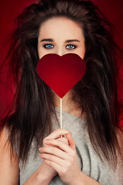 Young woman with heart symbol — Stock Photo, Image