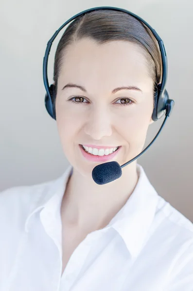Successful female call centre employee speaking — Stock Photo, Image