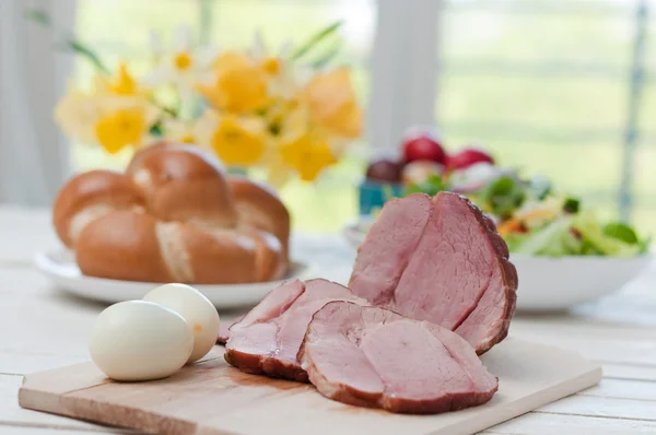 Ham and boiled eggs on a dinner table — Stock Photo, Image