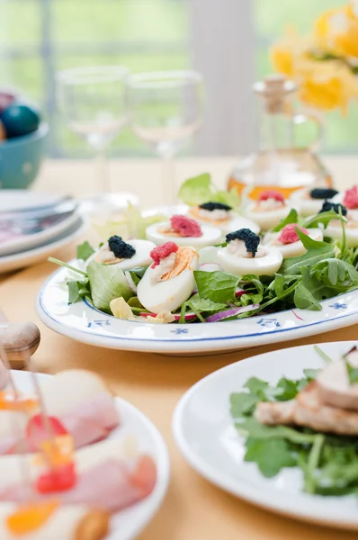 Boiled eggs with red and black caviar on Easter table — Stock Photo, Image