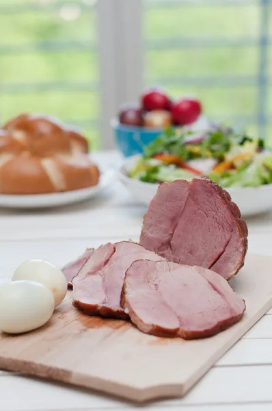 Ham and boiled eggs on a dinner table — Stock Photo, Image