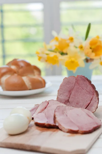 Ham and boiled eggs on a dinner table — Stock Photo, Image