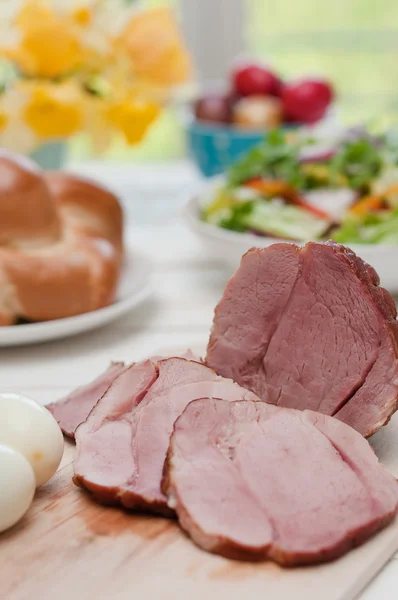 Ham and boiled eggs on a dinner table — Stock Photo, Image