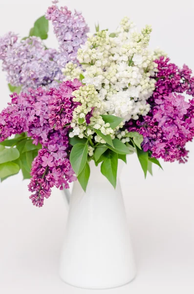 Beautiful bunch of lilac in the vase — Stock Photo, Image