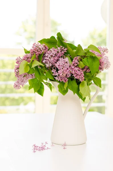 Beautiful bunch of lilac in the vase — Stock Photo, Image