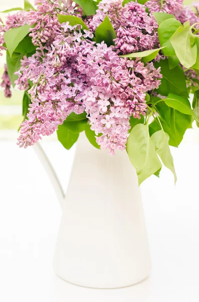 Beautiful bunch of lilac in the vase — Stock Photo, Image