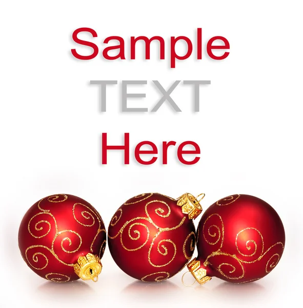 Tre palline di Natale rosse isolate su sfondo bianco — Foto Stock