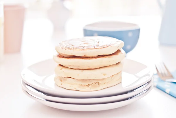 Delicious pancakes on morning breakfast table with fruits — Stock Photo, Image