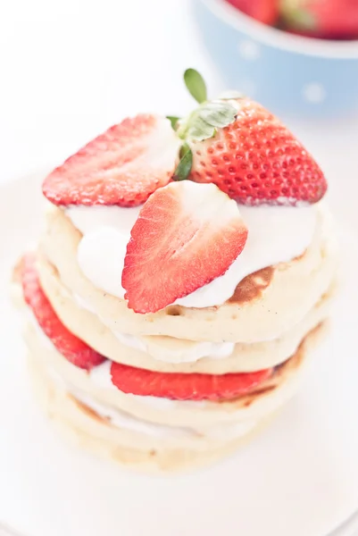 Delicious pancakes on morning breakfast table with fruits — Stock Photo, Image