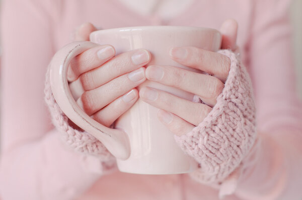 Tea. Woman holding tea cup.