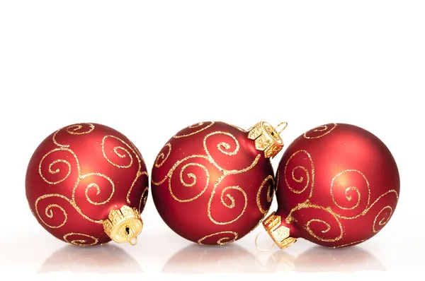 Three red christmas balls isolated on white background Stock Picture