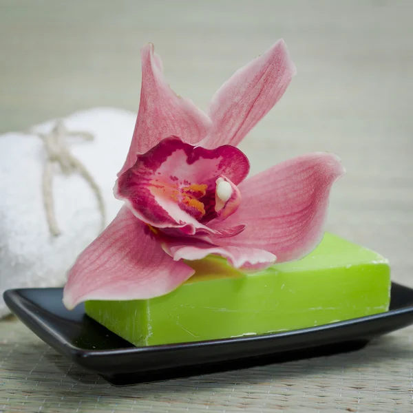 Bath items with orchid soap towel and soap — Stock Photo, Image