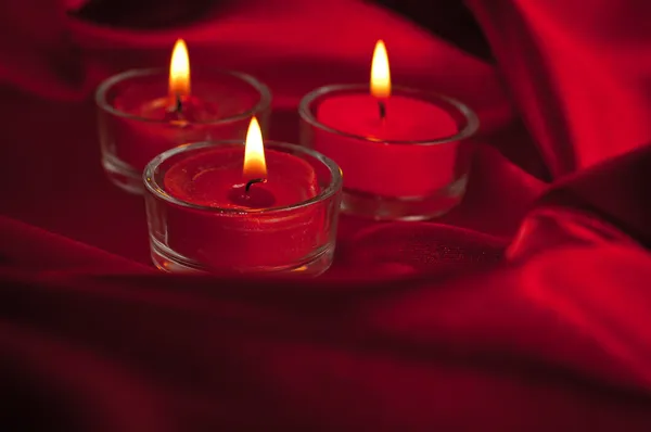 Valentines candles on satin background — Stock Photo, Image