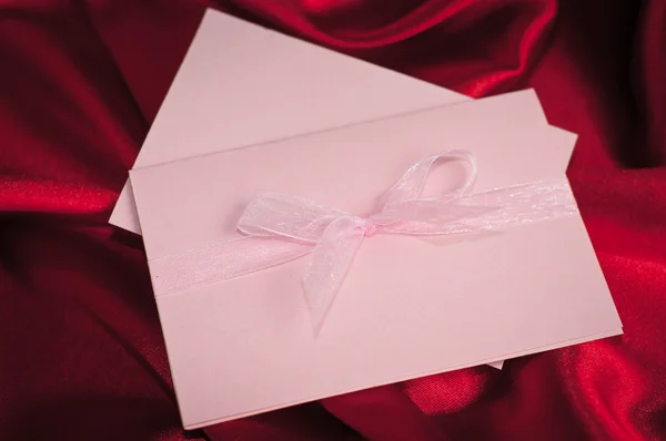 Invitation card on silk satin background. — Stock Photo, Image