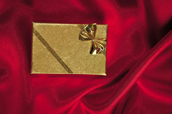 Present card on silk satin background. — Stock Photo, Image