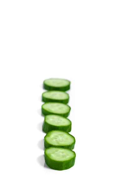 Cucumber and slices isolated over white background — Stock Photo, Image