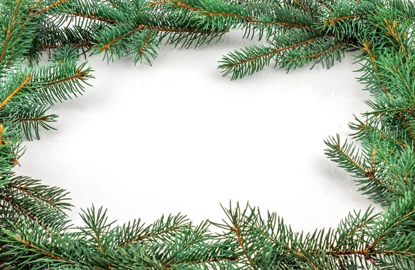 Pine branches with Christmas ornaments on white — Stock Photo, Image