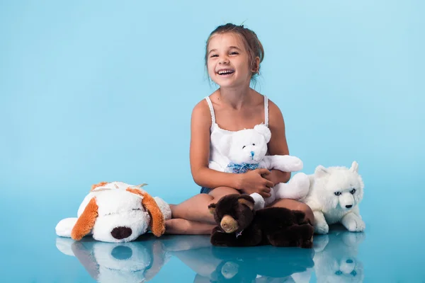 Cute little girl on blue background — Stock Photo, Image