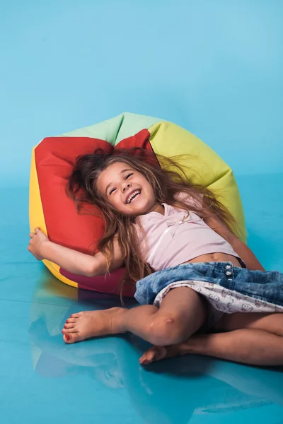 Cute little girl on blue background — Stock Photo, Image