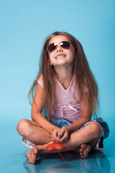 Cute little girl on blue background — Stock Photo, Image