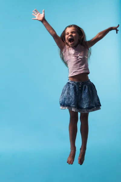 Portrait of a cheerful girl jumping — Stock Photo, Image