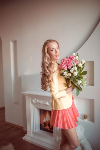 Beautiful woman with tulips — Stock Photo, Image