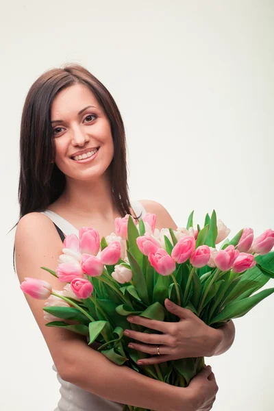 Girl with a bouquet Stock Picture