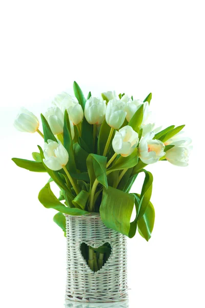 Beautiful tulips in basket with heart — Stock Photo, Image