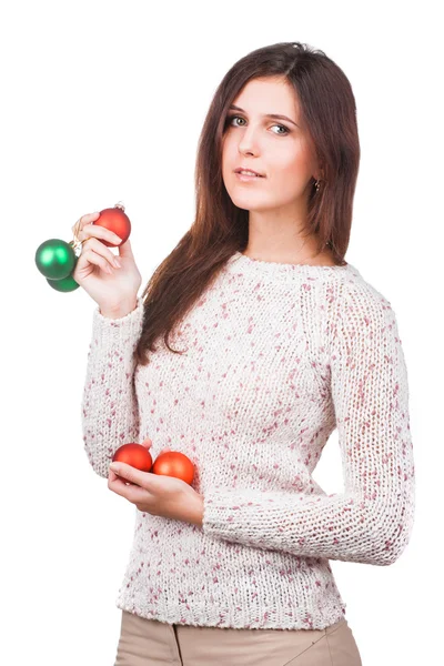 Portrait of a young girl in white sweater with christmas balls — Stock Photo, Image
