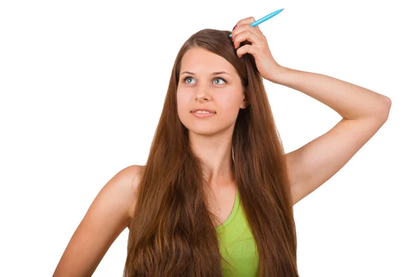 Girl posing with pen in studio — Stock Photo, Image