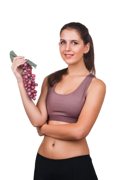 Mulher bonita segurando um monte de uvas — Fotografia de Stock