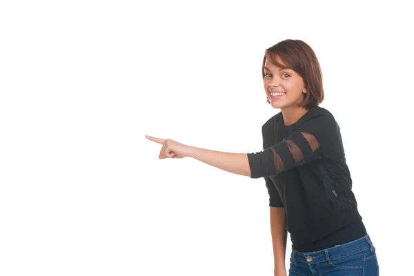 Menina adolescente bonita apontando para algo — Fotografia de Stock